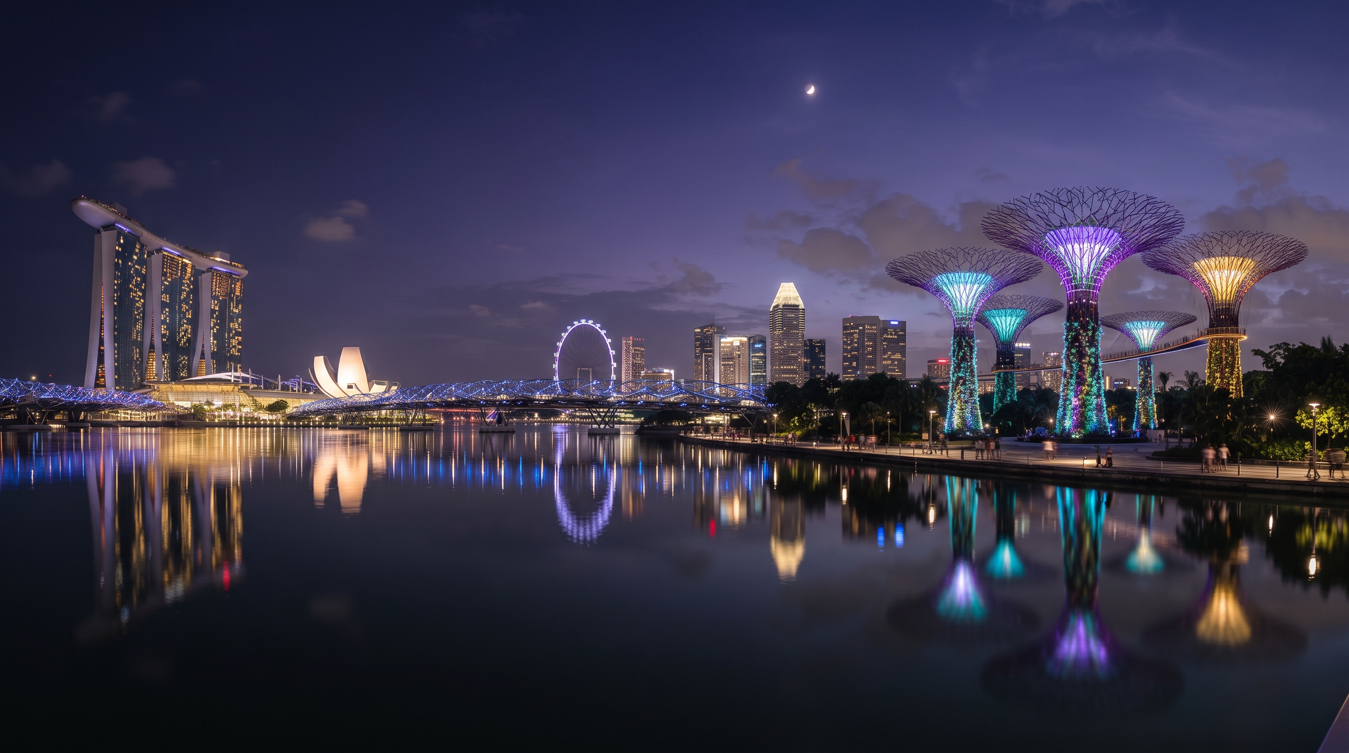 The Singapore skyline rising over the water at dusk